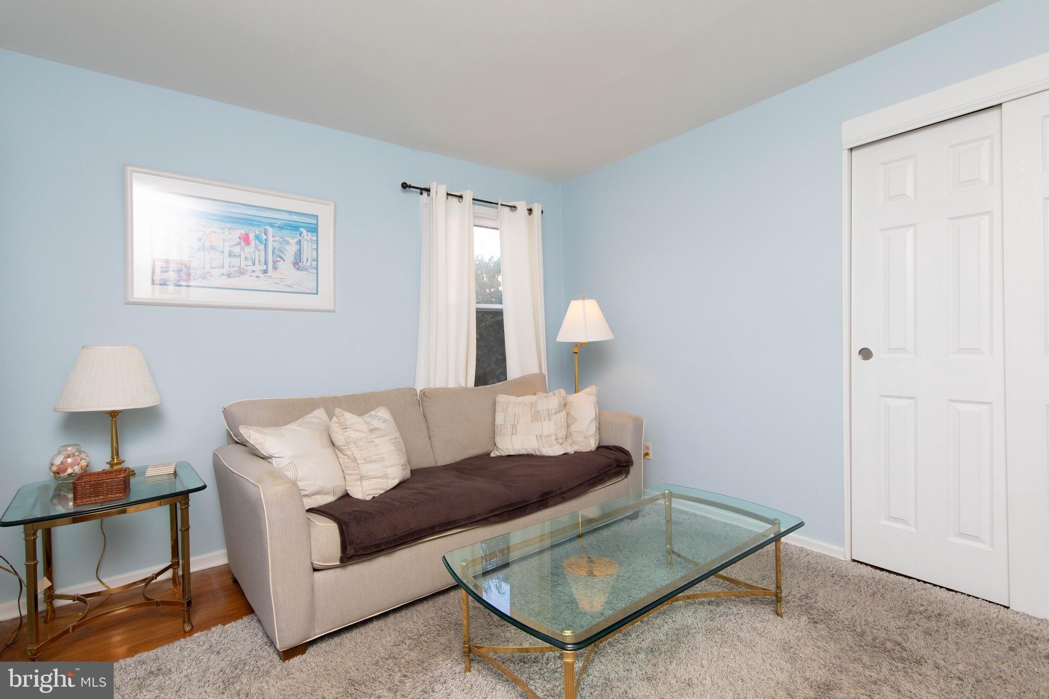 85 Manor Place Oreland, PA 19075 - Photo 16 of 22 a living room with furniture and a lamp