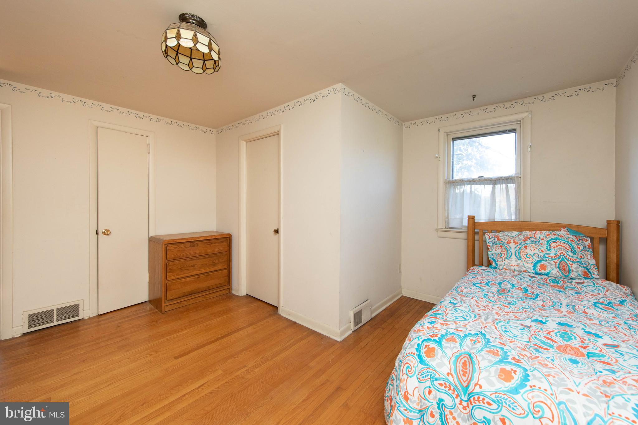 85 Manor Place Oreland, PA 19075 - Photo 18 of 22 a bedroom with a bed and a window