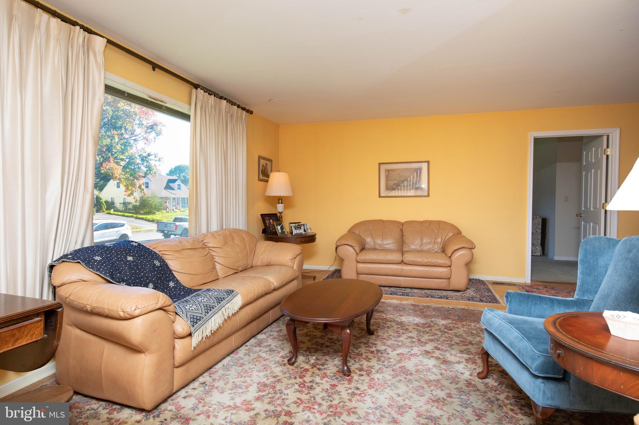 85 Manor Place Oreland, PA 19075 - Photo 3 of 22 a living room with furniture and a large window