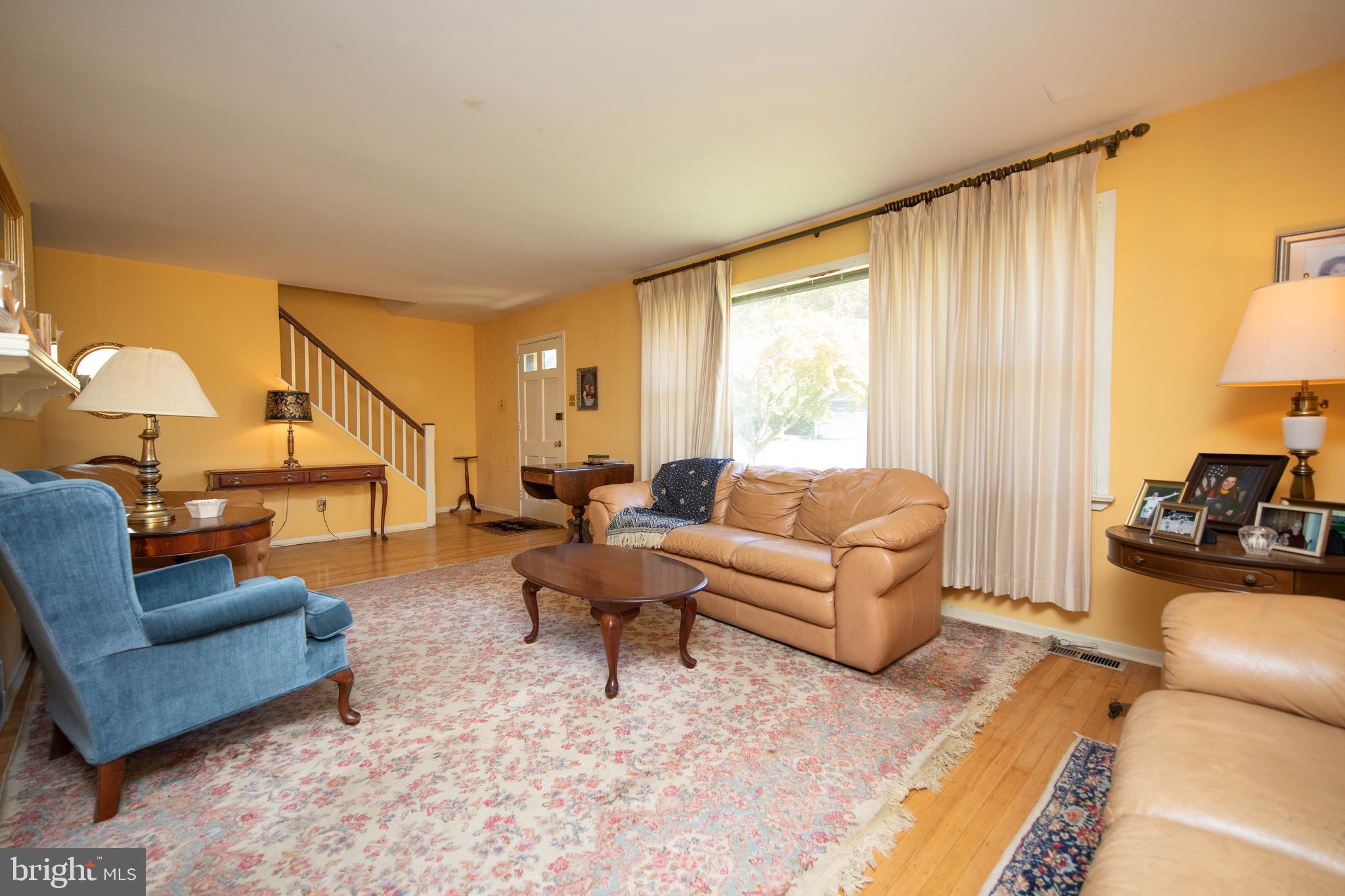 85 Manor Place Oreland, PA 19075 - Photo 5 of 22 a living room with furniture and a large window
