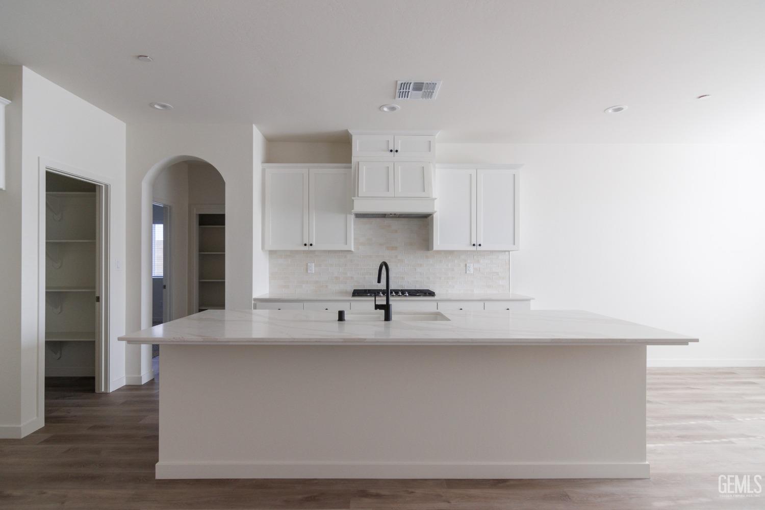 Undisclosed Address Bakersfield, CA 93311 - Photo 2 of 24 a view of kitchen with wooden floor