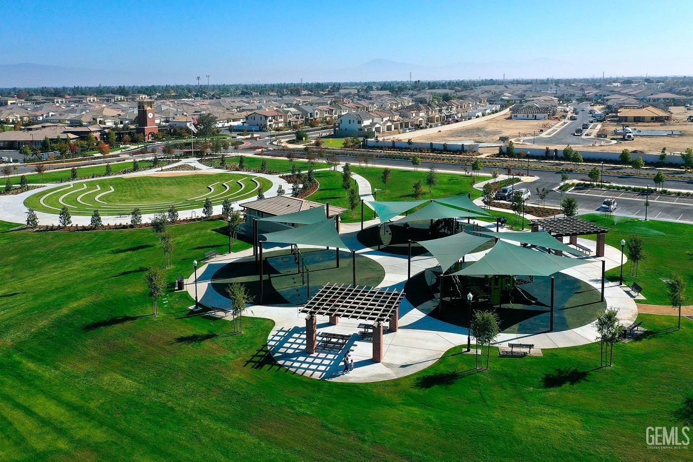 Undisclosed Address Bakersfield, CA 93311 - Photo 21 of 24 an aerial view of a house with a garden and lake view