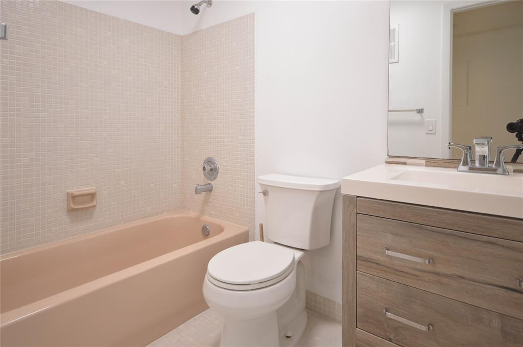 9499 West McNab Road, Unit 208 Tamarac, FL 33321 - Photo 10 of 12 a bathroom with a sink a toilet and bathtub