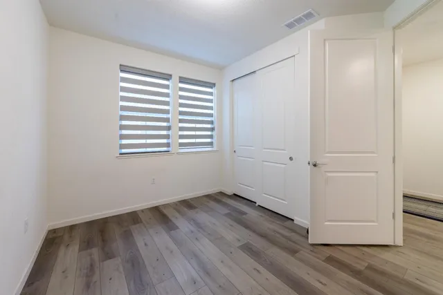 a view of entryway with stairs and wooden floor