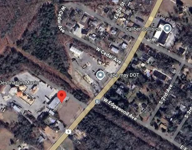 an aerial view of multiple houses with yard