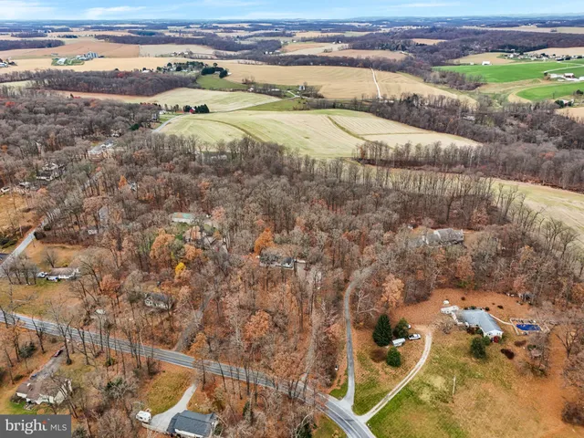 a view of a field with an ocean view