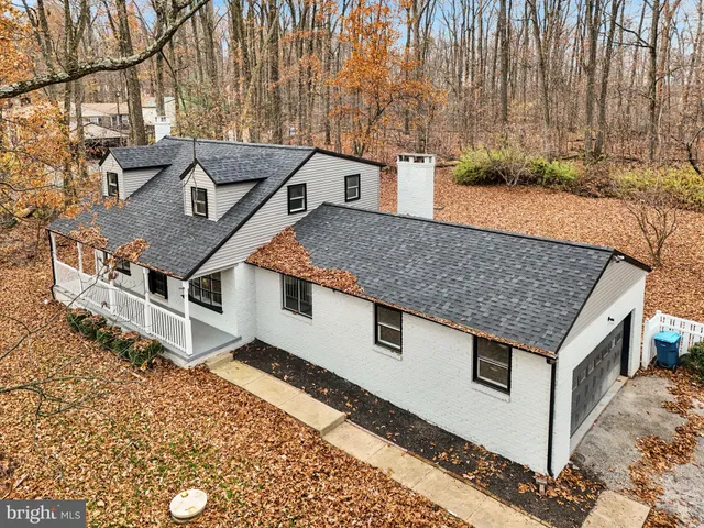 a aerial view of a house with a yard