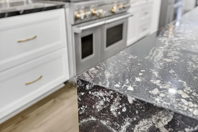 a view of a room with wooden floor and white walls