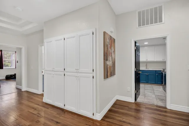 a spacious bedroom with a bed and ceiling fan