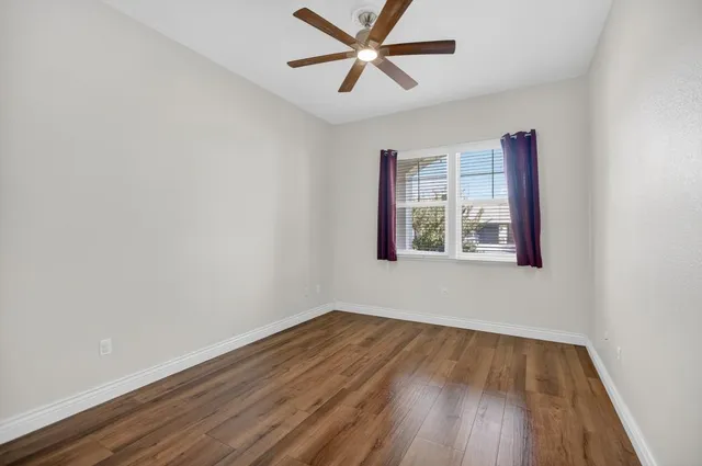 a view of a bathroom with a window and a shower
