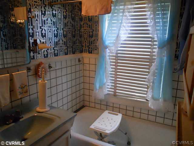 178 Buckner Road Bumpass, VA 23024 - Photo 11 of 16 a bathroom with a sink and a vanity