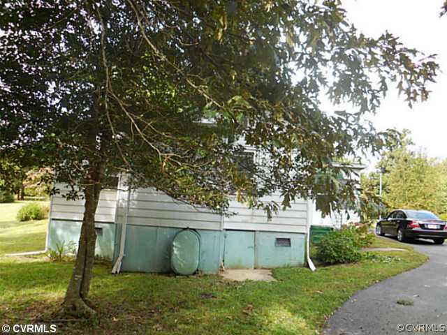 178 Buckner Road Bumpass, VA 23024 - Photo 14 of 16 a view of a house with a backyard