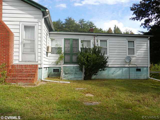 178 Buckner Road Bumpass, VA 23024 - Photo 15 of 16 a view of a house with a yard