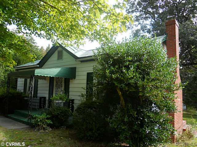 178 Buckner Road Bumpass, VA 23024 - Photo 2 of 16 a front view of a house with a yard