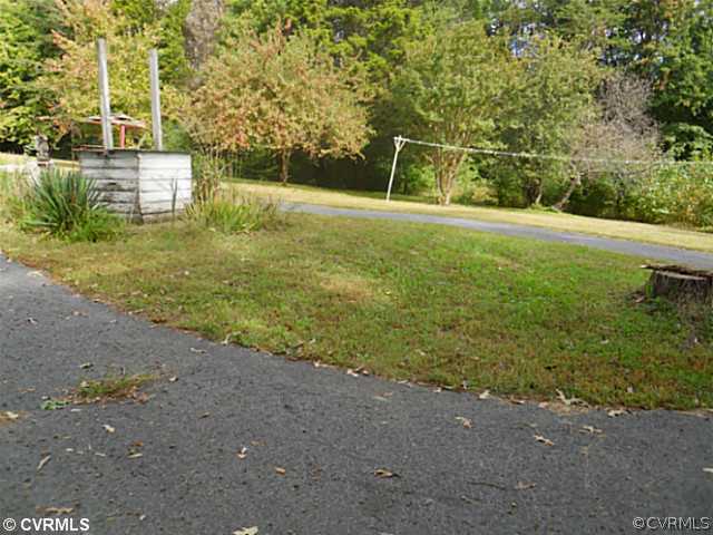 178 Buckner Road Bumpass, VA 23024 - Photo 4 of 16 a view of a field with an trees