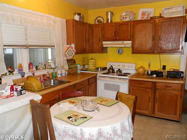 178 Buckner Road Bumpass, VA 23024 - Photo 5 of 16 a kitchen with a sink and cabinets
