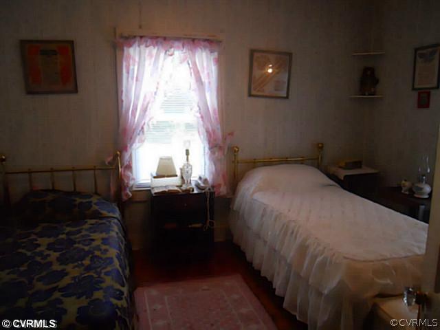 178 Buckner Road Bumpass, VA 23024 - Photo 8 of 16 a bedroom with a bed and a window