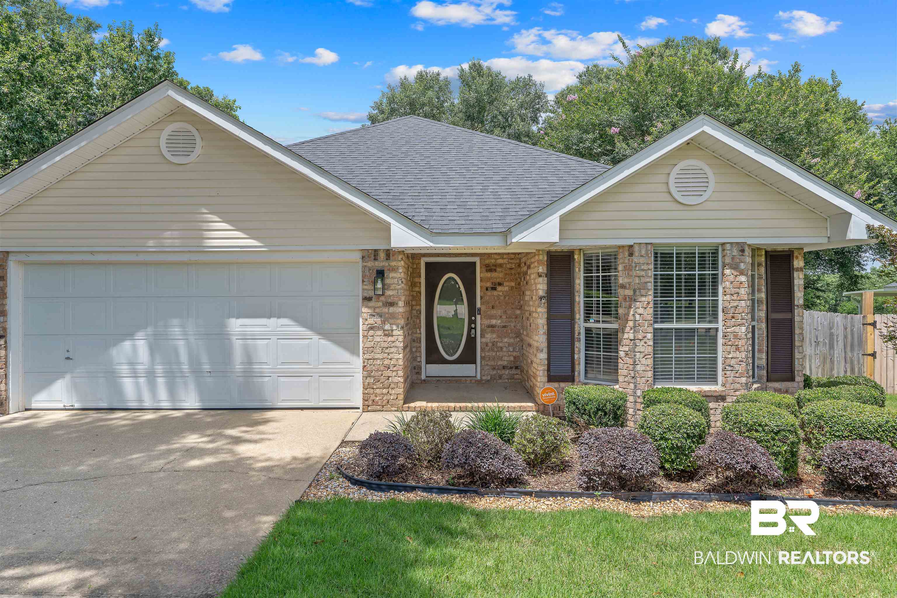 11097 Pontchartrain Loop Daphne, AL 36526 - Photo 1 of 28 Single story home featuring a shingled roof, a garage, and concrete driveway