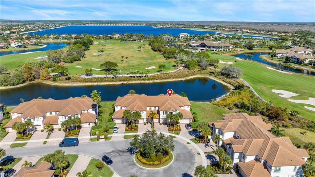 an aerial view of a house with a lake view