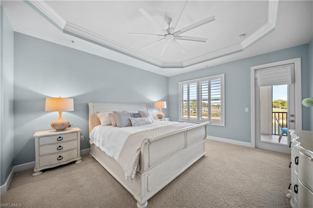 9220 Quartz Lane, Unit 202 Naples, FL 34120 - Photo 14 of 47 a bed room with a bed and a night stand