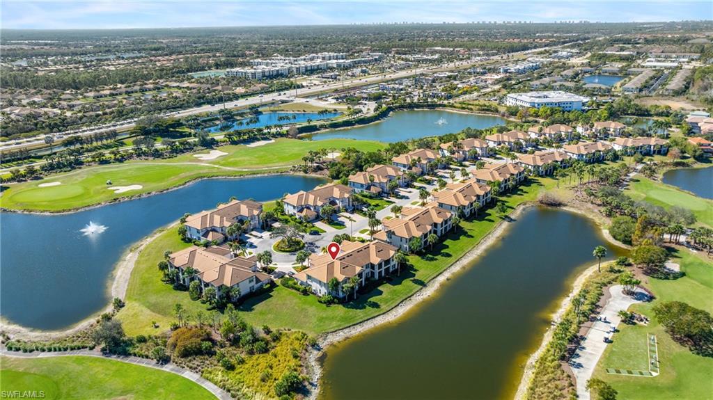 9220 Quartz Lane, Unit 202 Naples, FL 34120 - Photo 29 of 47 view of a city with an ocean view