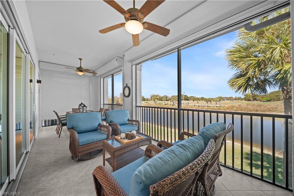 9220 Quartz Lane, Unit 202 Naples, FL 34120 - Photo 5 of 47 a balcony with furniture and a potted plant
