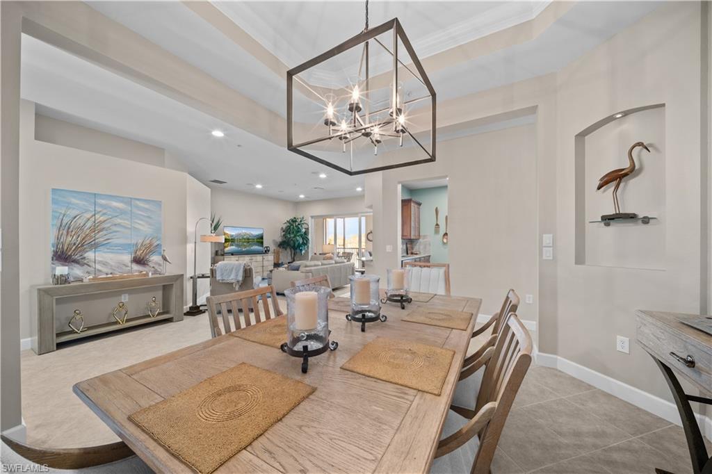 9220 Quartz Lane, Unit 202 Naples, FL 34120 - Photo 9 of 47 a view of a dining room with furniture