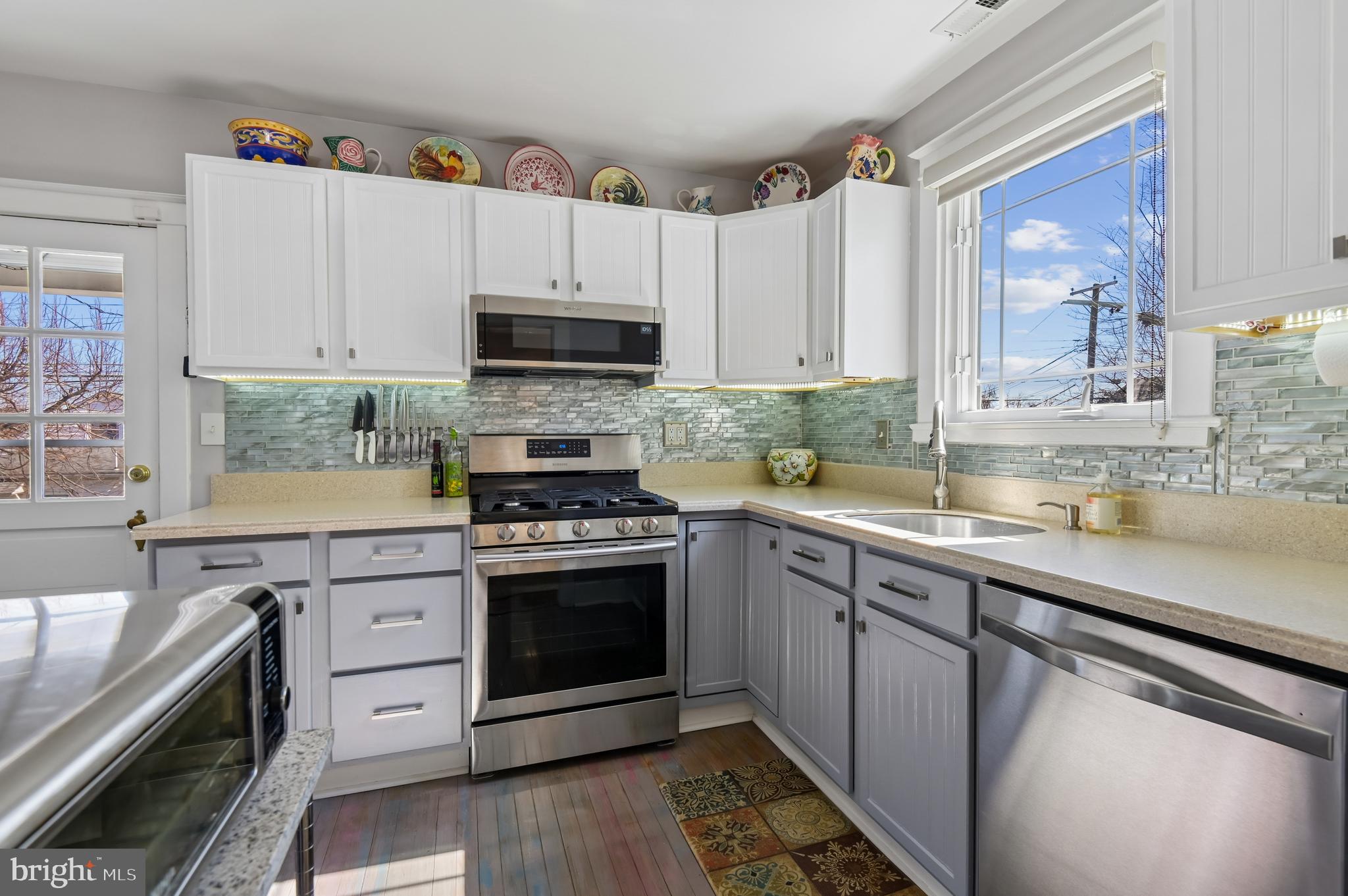 2724 Alden Road Parkville, MD 21234 - Photo 13 of 65 a kitchen with stainless steel appliances a stove a sink and a microwave