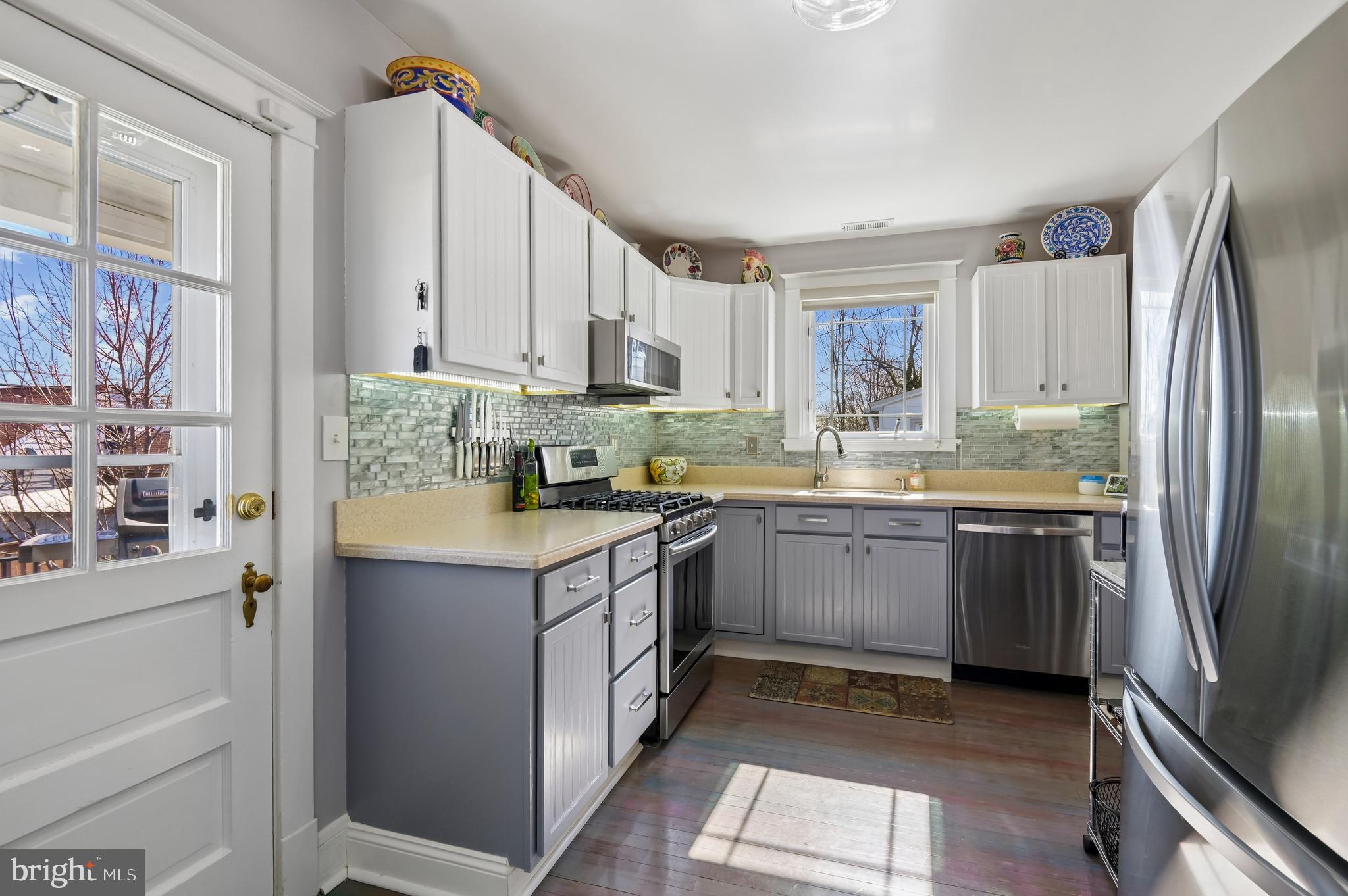2724 Alden Road Parkville, MD 21234 - Photo 14 of 65 a kitchen with a refrigerator sink and cabinets