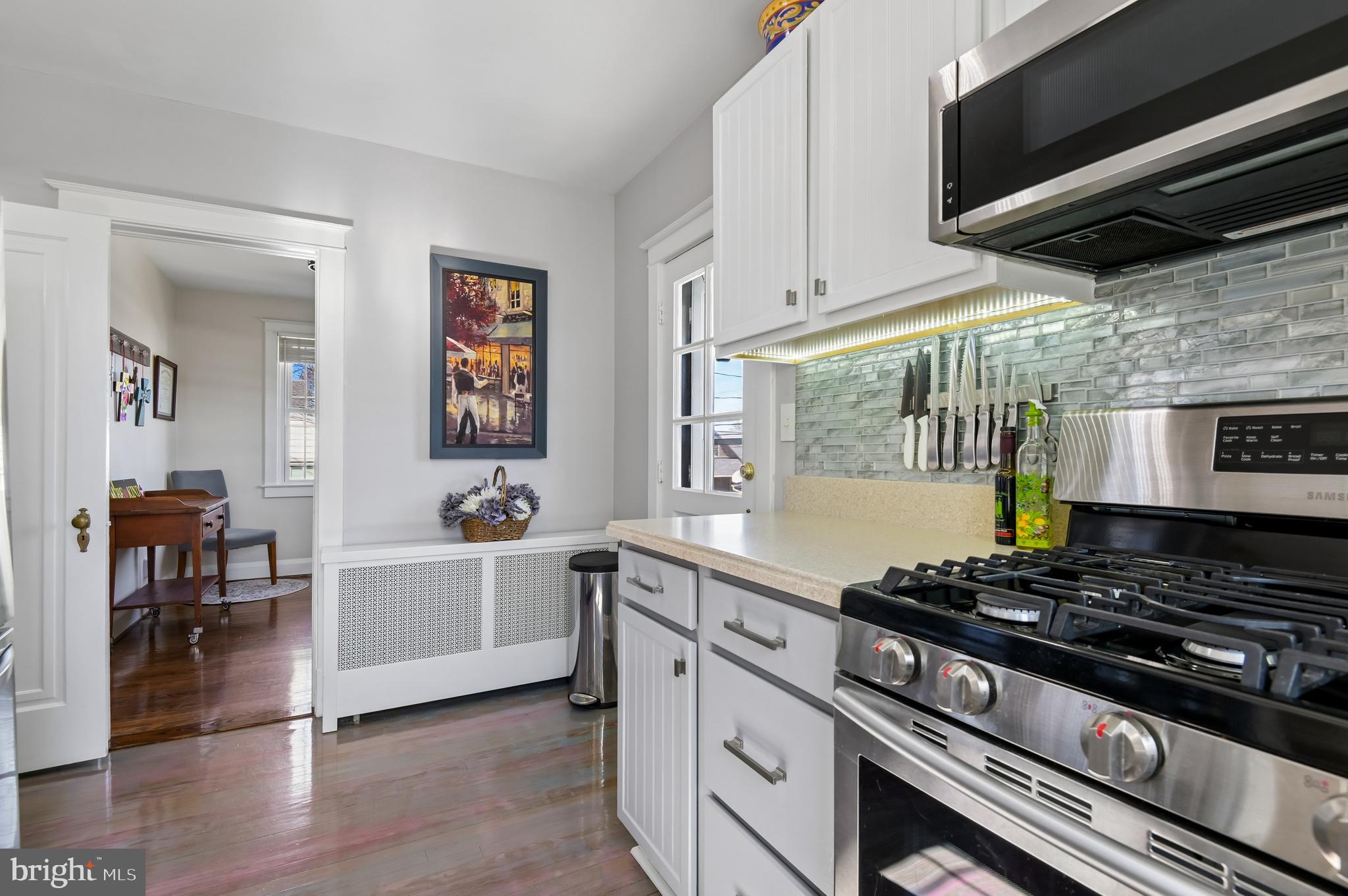 2724 Alden Road Parkville, MD 21234 - Photo 16 of 65 a kitchen with a stove and a wooden floor