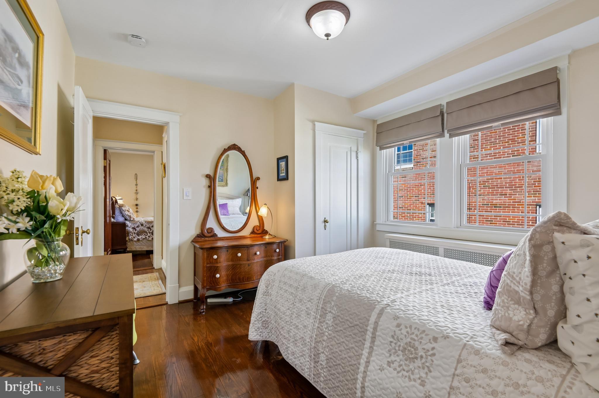 2724 Alden Road Parkville, MD 21234 - Photo 21 of 65 a bedroom with a bed and a potted plant