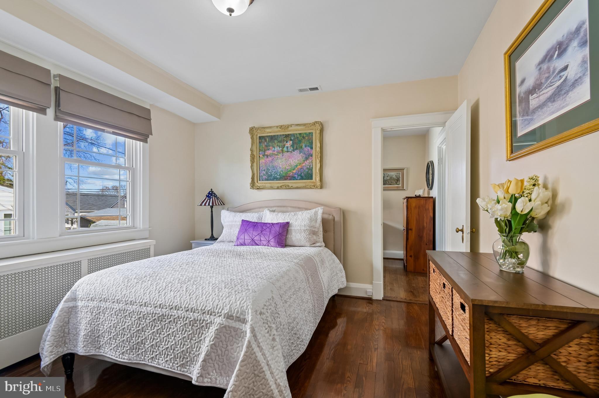 2724 Alden Road Parkville, MD 21234 - Photo 22 of 65 a bedroom with a bed and a table with potted plant