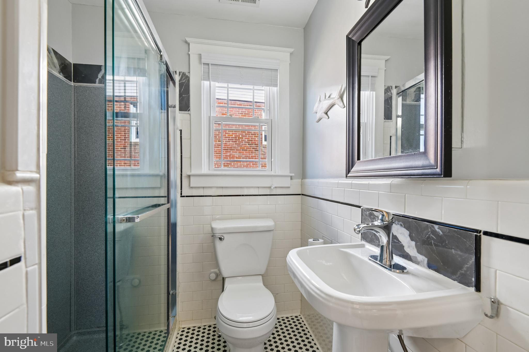 2724 Alden Road Parkville, MD 21234 - Photo 24 of 65 a bathroom with a sink toilet and shower
