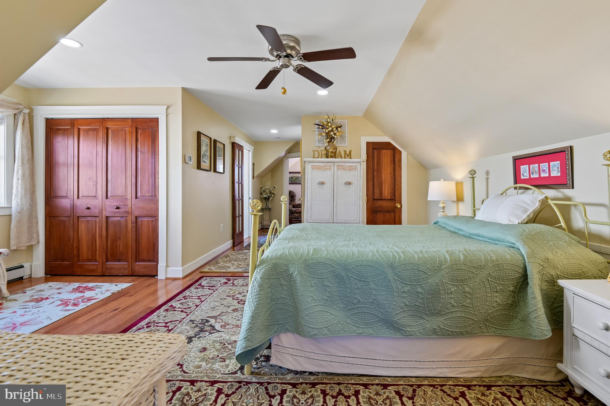 2724 Alden Road Parkville, MD 21234 - Photo 29 of 65 a spacious bedroom with a bed and a chandelier