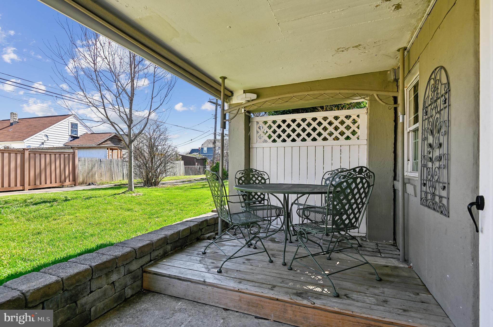 2724 Alden Road Parkville, MD 21234 - Photo 53 of 65 a view of a chairs and table in backyard of the house