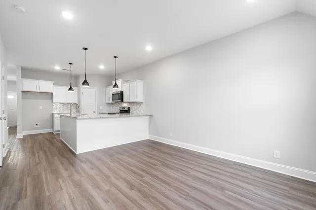 a view of kitchen with wooden floor