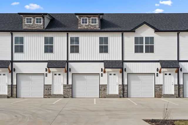 a front view of a house with a garage