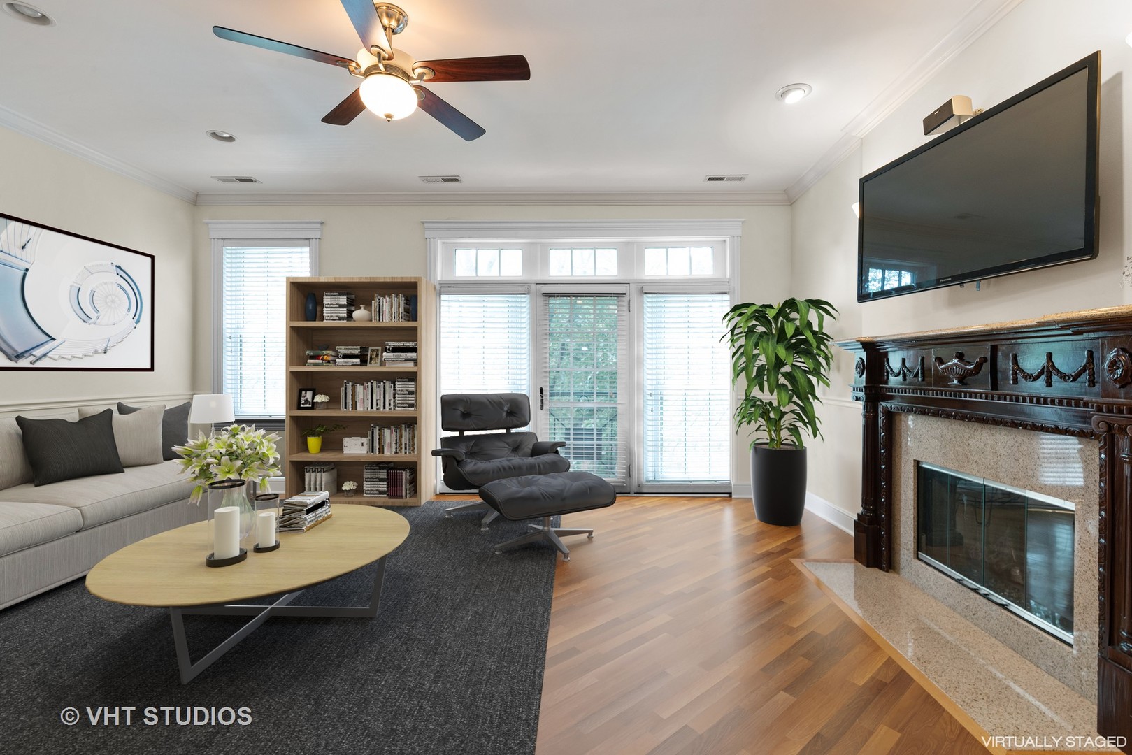 3535 North Reta Avenue, Unit 3 Chicago, IL 60657 - Photo 2 of 18 a living room with furniture a fireplace and a flat screen tv