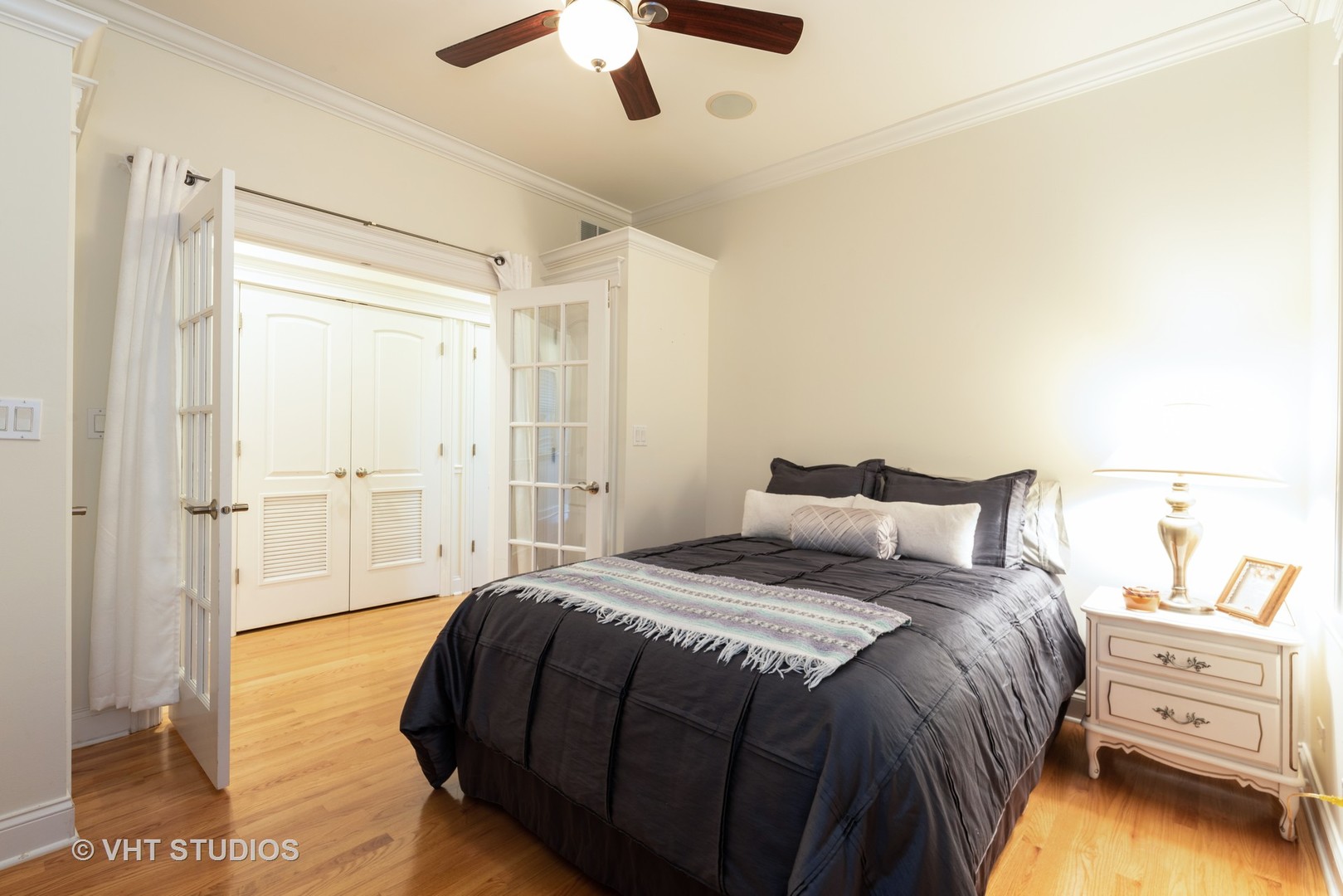 3535 North Reta Avenue, Unit 3 Chicago, IL 60657 - Photo 14 of 18 a bedroom with a bed and a chandelier
