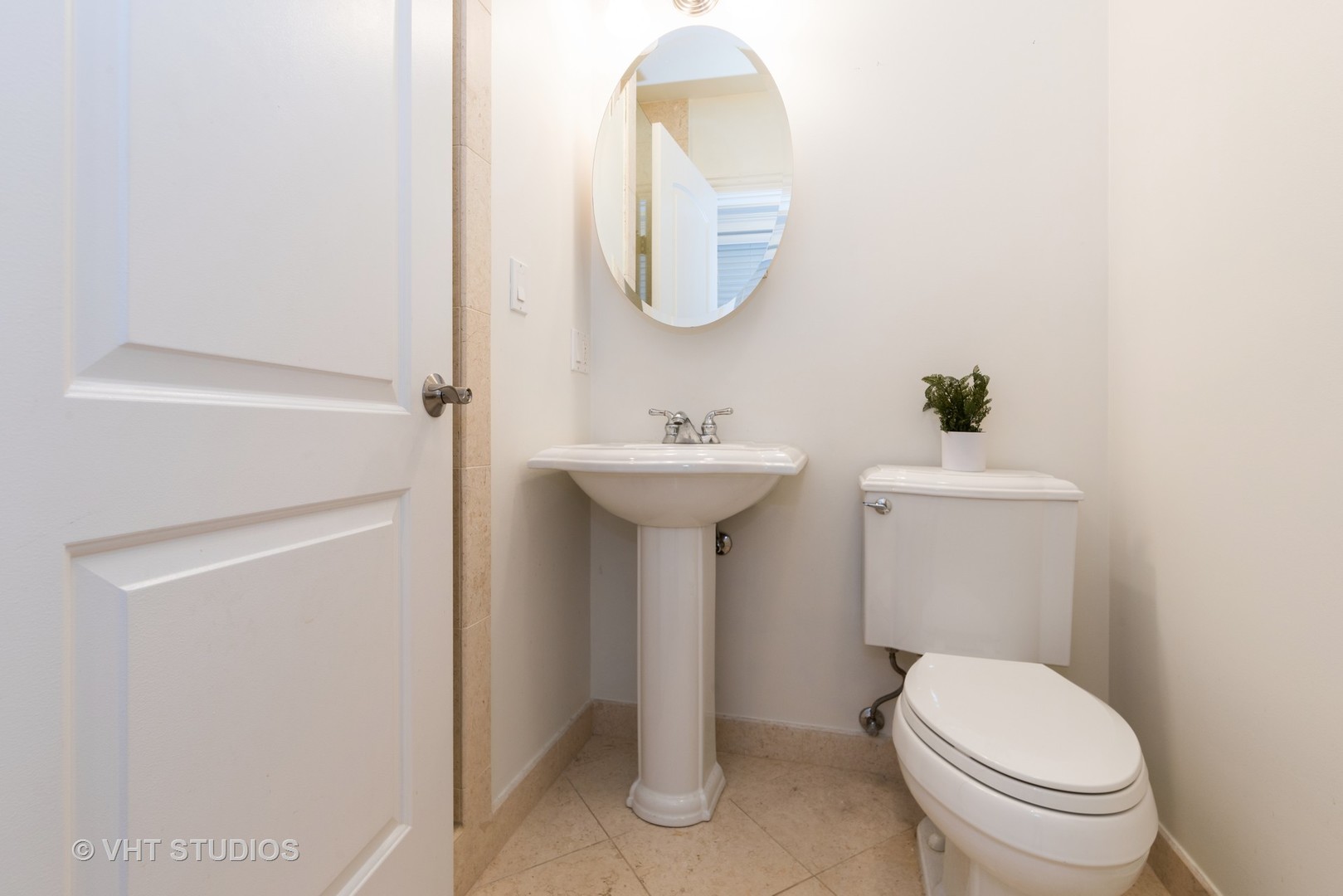 3535 North Reta Avenue, Unit 3 Chicago, IL 60657 - Photo 15 of 18 a bathroom with a sink toilet and a mirror