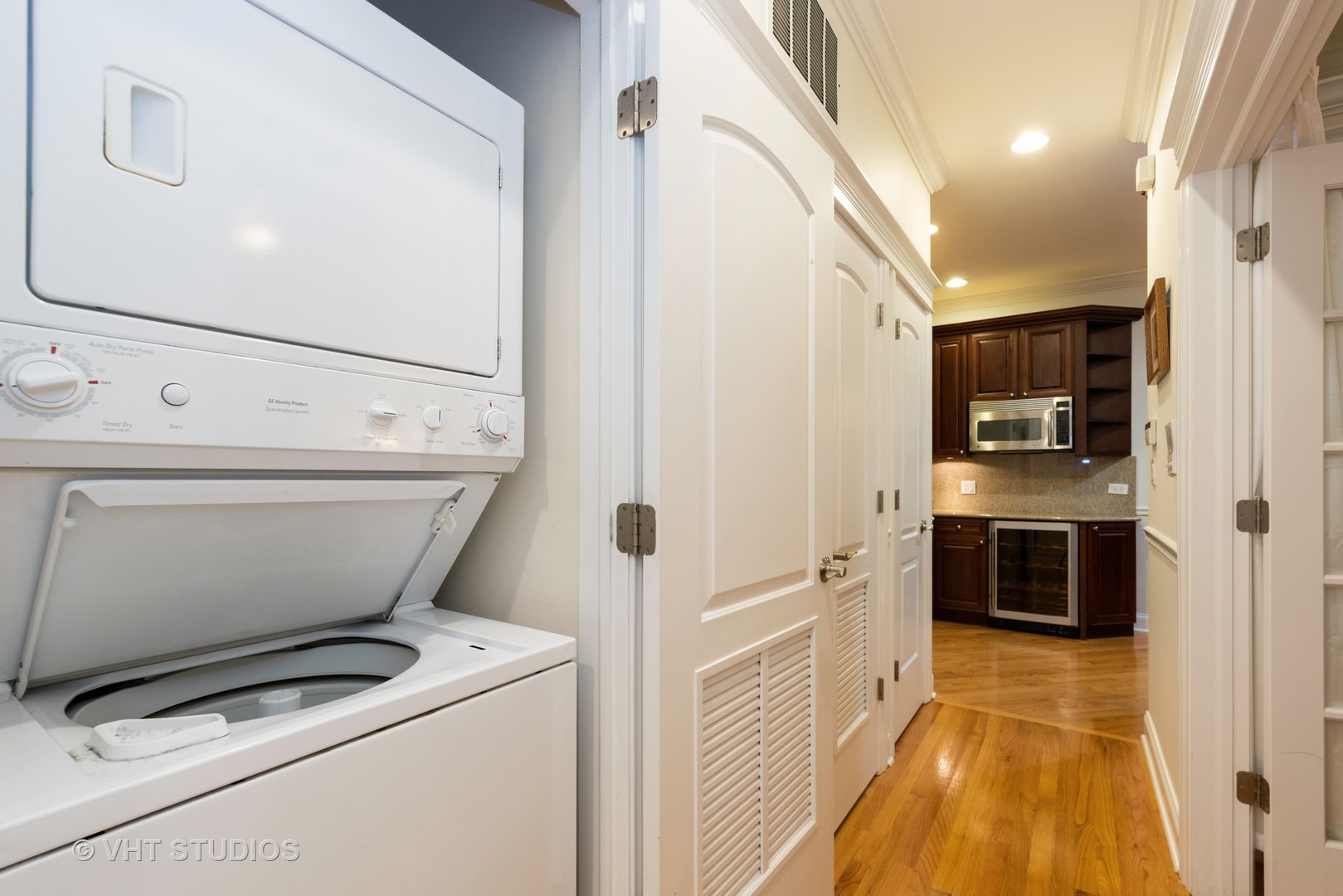 3535 North Reta Avenue, Unit 3 Chicago, IL 60657 - Photo 16 of 18 a view of washer and dryer with kitchen in the background
