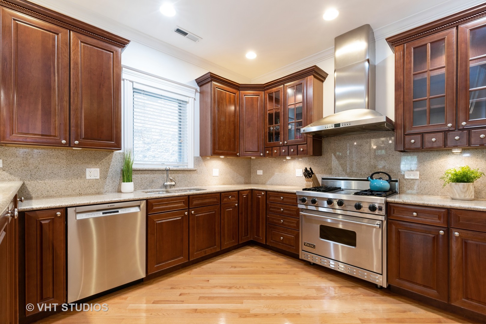 3535 North Reta Avenue, Unit 3 Chicago, IL 60657 - Photo 4 of 18 a kitchen with stainless steel appliances granite countertop wooden cabinets a sink and a stove