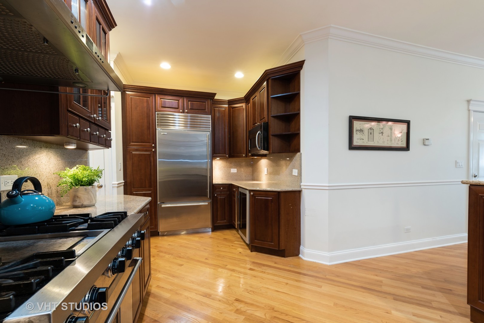3535 North Reta Avenue, Unit 3 Chicago, IL 60657 - Photo 10 of 18 a kitchen with stainless steel appliances a stove a refrigerator and a refrigerator