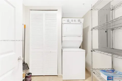 a view of bathroom with a washer and dryer
