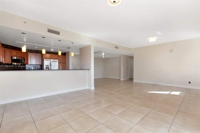 a view of a kitchen and a livingroom