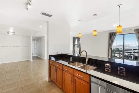 a kitchen with sink and window