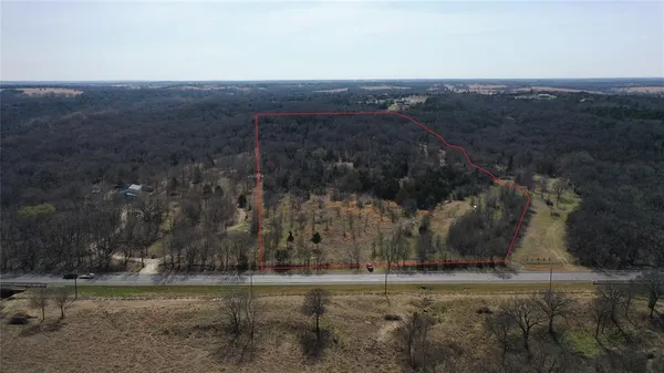 an aerial view of a yard with mountain view