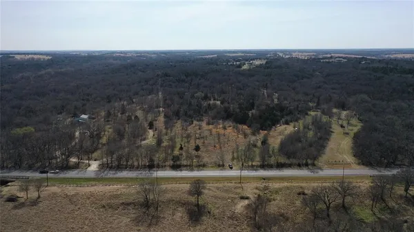 an aerial view of a town with trees