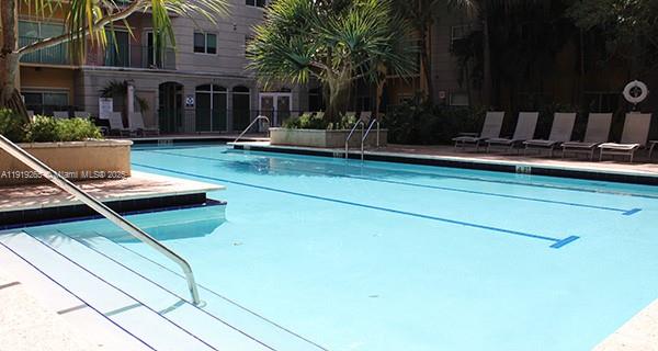 6001 Southwest 70th Street, Unit 525 South Miami, FL 33143 - Photo 13 of 14 a front view of house with a garden