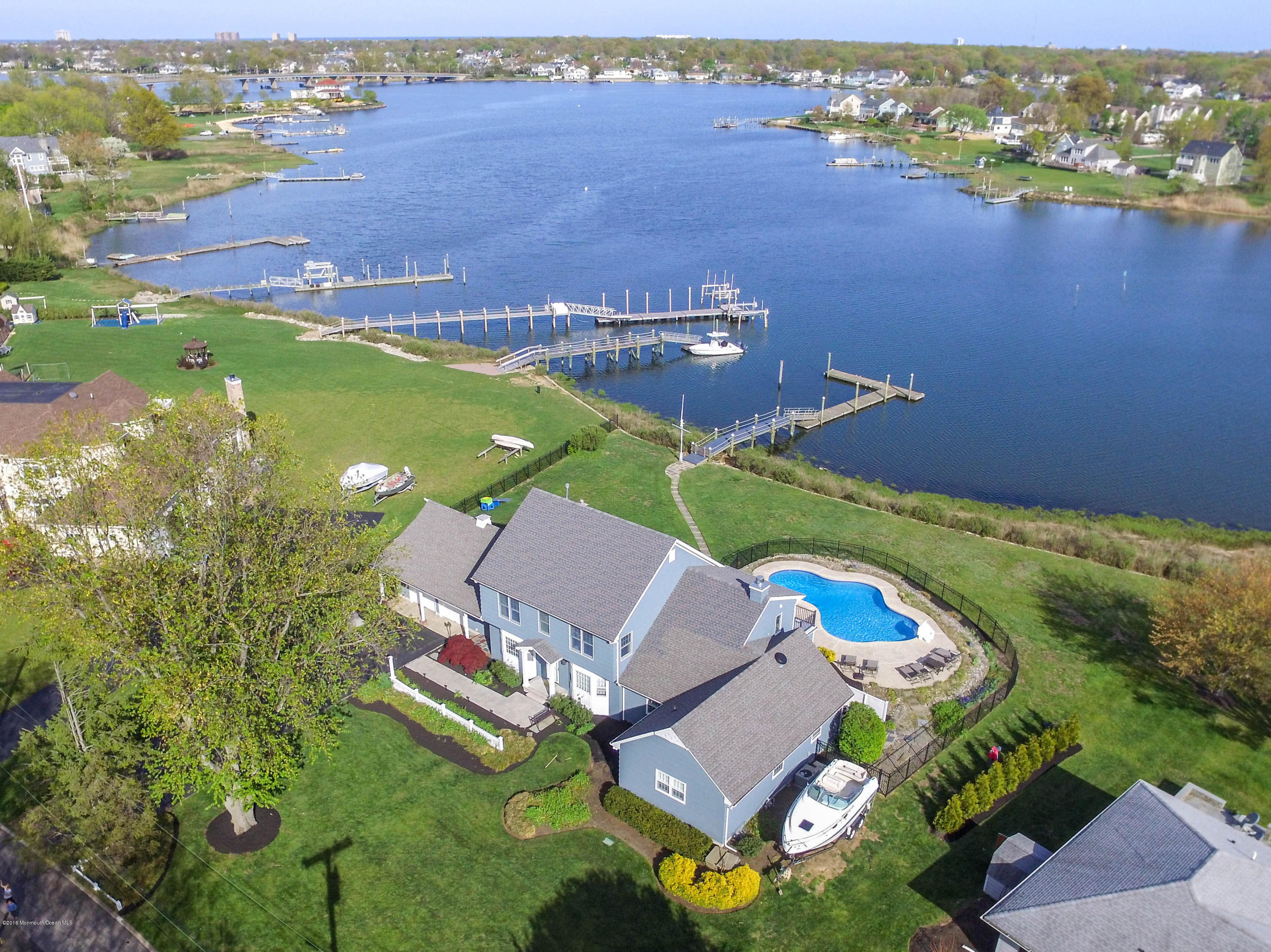 68 Rivers Edge Drive Little Silver, NJ 07739 - Photo 1 of 25 an aerial view of a house with a lake view